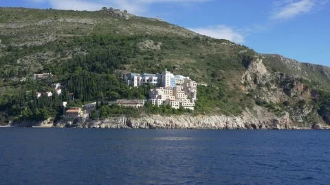 Passing by tracking shot of abandoned Hotel Belvedere in Dubrovnik from Sea Stock Footage 71177802