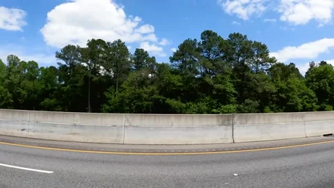 Passing traffic Bobby Jones Highway on a blue sky with clouds beautiful day Stock Footage 185617085