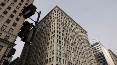 Passing Traffic Light In City Looking Up At Tall Buildings Stock-Footage 167738119