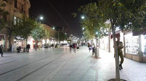 Passing Train and Night Shoppers Stock Footage 57200169