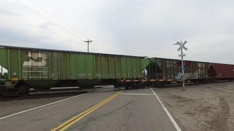 Passing train with crossing arms down Stock Footage 74435126