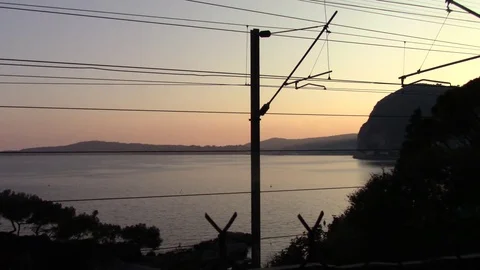 Passing of a train at dusk Stock Footage 74973271