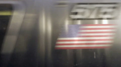 Passing train from MTA subway with graffiti on building in background in NYC Stock Footage 59841770