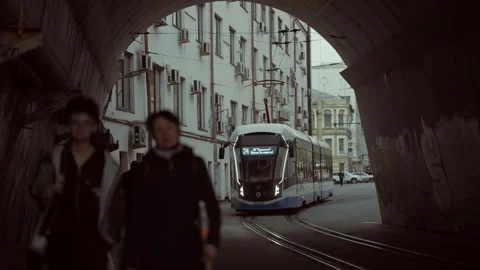 Passing tram on rails through an old tunnel Stock Footage 153371019