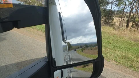 Passing transportation viewed by side mirror Stock Footage 114114204