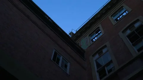 Passing under bridge old derelict building at dusk nearly dark and spooky Vídeos de archivo 170467131