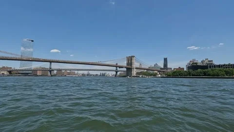 Passing Underneath Manhattan and Brooklyn Bridge Timelapse Featuring Boats Stock Footage 219162527