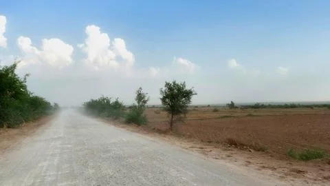 Passing Vehicle Creates Clouds Of Dust On Rural Dirt Track Stock Photos