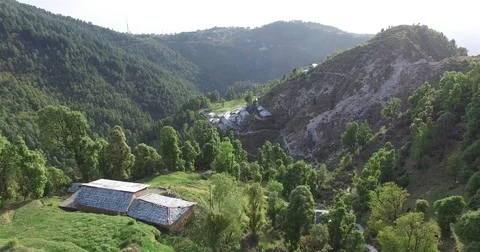 Passing Wheat Fields and Green Valley Stock Footage 80984835