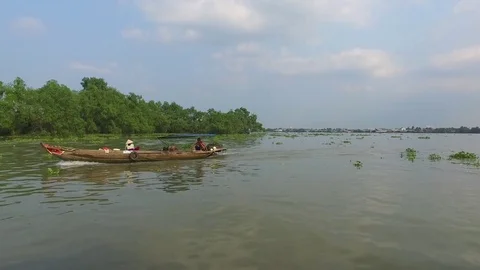 Passing workboats on the Mekong River Stock Footage 73283187