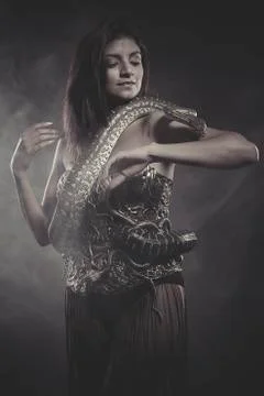 Passion, brunette woman posing with a python snake australian Stock Photos