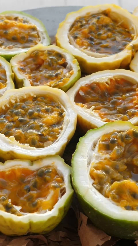 Passion fruit background with half cut chinola. A lot of sliced maracuja Stock Footage 327096747