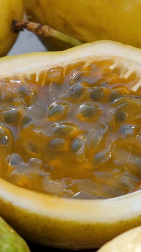 Passion fruit background with half cut chinola. A lot of sliced maracuja Stock Footage 327096800