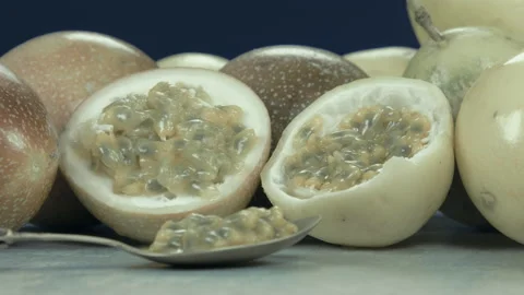 Passion fruit closeup exotic macro closeup exotic section half out seeds Video stock 94594585