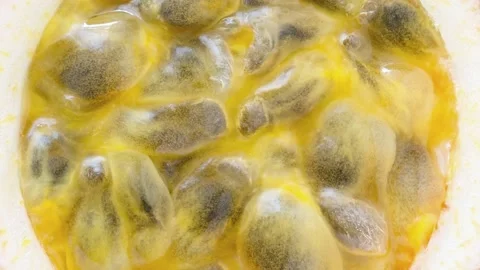 Passion fruit cut inside with seeds Stock-Footage 165899116