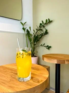Passion fruit lemonade on a round table Stock Photos