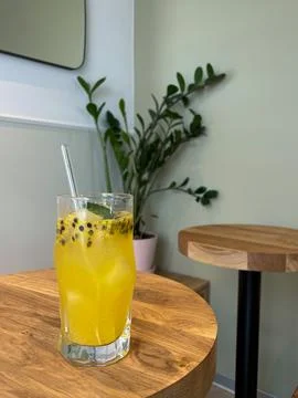 Passion fruit lemonade on a round table Stock Photos