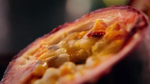 Passion Fruit Rolling Open After Cut in Cinematic Macro Close Up Stock Footage 328978879