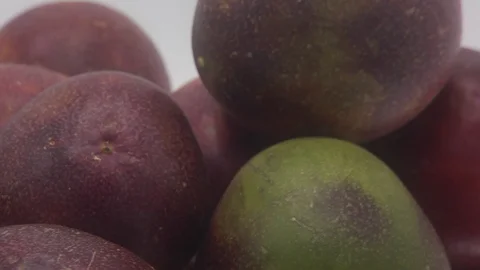 Passion fruit rotating on white background Stock Footage 126111423