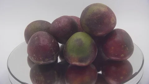 Passion fruit rotating on white background Stock Footage 126111662