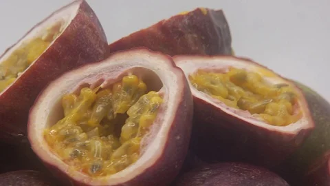 Passion fruit rotating on white background Stock Footage 126111723