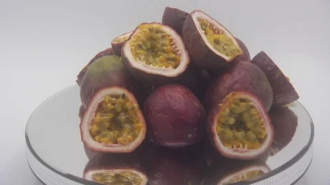 Passion fruit rotating on white background Stock Footage 126111766
