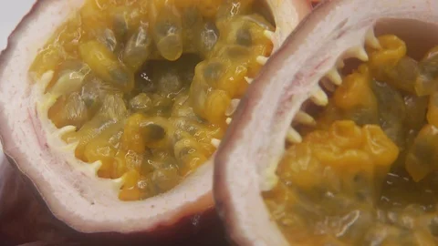 Passion fruit rotating on white background Stock Footage 126111857