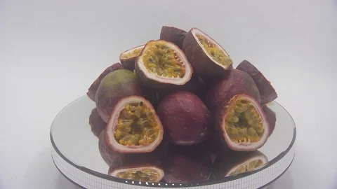 Passion fruit rotating on white background Stock Footage 126112259