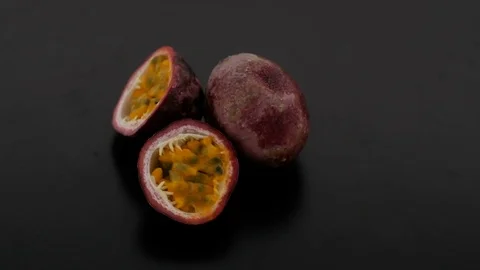 Passion Fruit on Turntable - Black Background Stock Footage 75860569