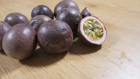 Passion fruit on wooden table. Circular Movement Видео 93794680
