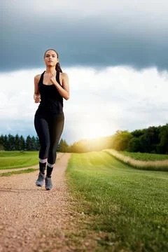 Passion is pushing yourself when no one else is around. a fit young woman out Fotos de archivo