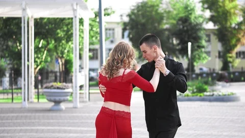 Passionate couple dancing a passionate dance on the street Stock Footage 114683466