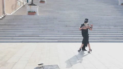 Passionate couple dancing a passionate Tango dance on the street. Stock Footage 163455517