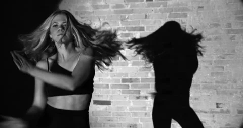 Passionate Dancer Prancing With a Backdrop of Brick Wall and a Focused Light Stock Footage 158846963