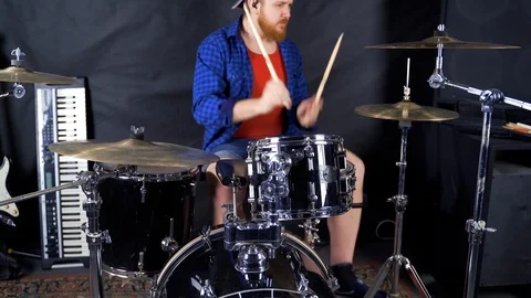 Passionate drummer playing a rhythm on the drum kit Stock Footage 123898174