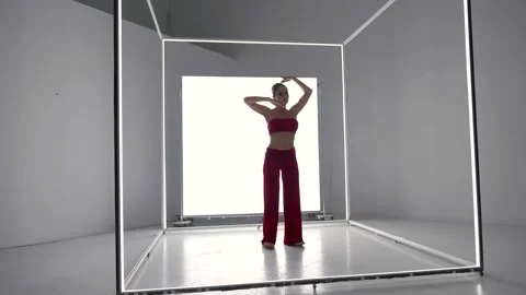 Passionate female dancer is dancing in studio, performing modern dance, eclectic Stock-Footage 169256084