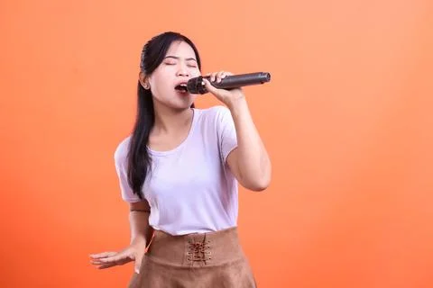 Passionate Performance with Microphone Stock Photos