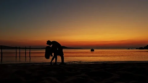 Passionate Romantic Couple Dance Dip at Sunset Beach Silhouette Video stock 335522192
