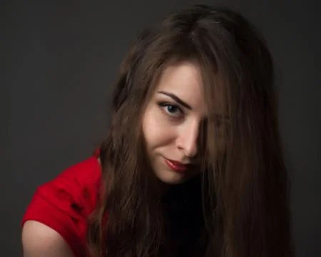Passionate woman in a red dress Stock Photos