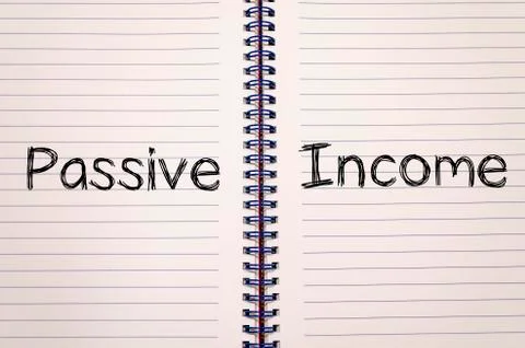 Passive income write on notebook Stock Photos