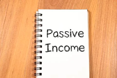Passive income write on notebook Stock Photos
