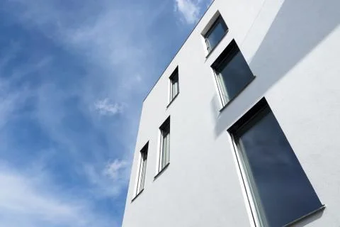Passive modern building with large windows on a sunny day Stock Photos