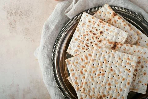 Passover celebration concept. Matzah, red kosher and walnut. Traditional ritu Stock Photos