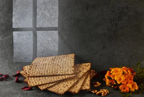Passover is the Jewish Passover. A stack of matzo on a wooden cutting board with Stock Photos