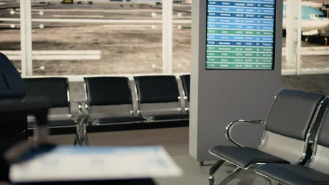 Passport and plane ticket, close up, empty airport terminal, transport hub Stock Footage 333245497