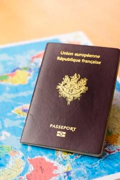 Passport and world's map on table Stock Photos