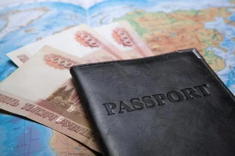 Passport in the bag on a map with bank notes Stock Photos