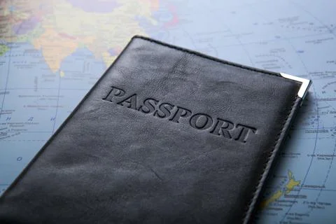 Passport in the bag on a map Stock Photos