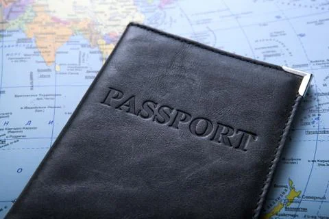 Passport in the bag on a map Stock-Fotos