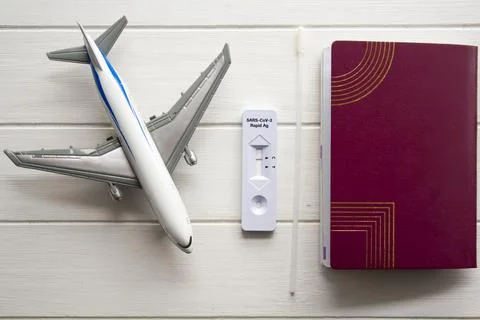 Passport, COVID-19 negative test and airplane. Travel during COVID-19 pandemi Stock Photos